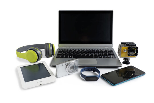 Laptop computer with smartphone and camera and ebook reader and other obsolete electronic gadgets on white background, Reuse and Recycle concept