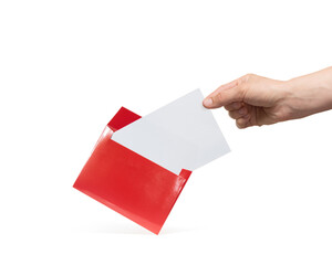 A hand takes a sheet of white paper from a red envelope. Mockup. Isolated on white.