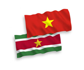 Flags of Republic of Suriname and Vietnam on a white background