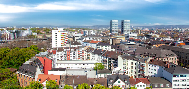 Aerial view of the City of Mainz with railroad station in Germany in background on blue clouds sky