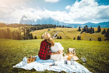 Romantic couple on vacation visiting italian dolomites alps - Man and woman having fun together...