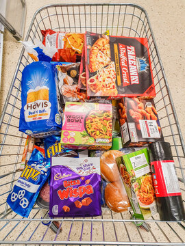 SHEFFIELD, UK - 20TH MARCH 2019: Full shopping trolley full of food and drink at Tesco