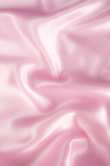 Abstract pink silk fabric texture background. Cloth soft wave. Creases of satin