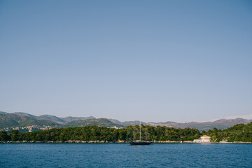 Fototapeta na wymiar Three-masted wooden yacht off the Croatian islands.