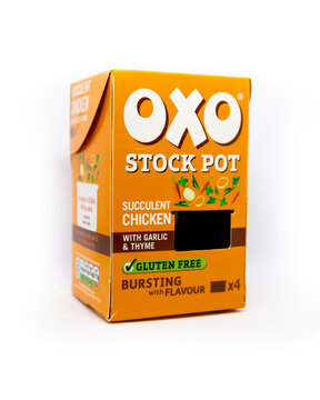 Orange Oxo stock pot box of succulent chicken on an isolated white background
