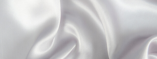 Abstract gray silk fabric texture background. Cloth soft wave. Creases of satin