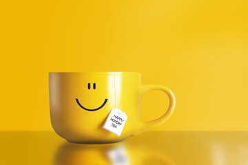 Thank god it's monday happy tea with happy face on big yellow cup on yellow background. The most happiest and motivation day of the year. No blue monday concept. Copy space.