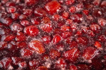 Strawberry jam is boiling, detailed shooting.