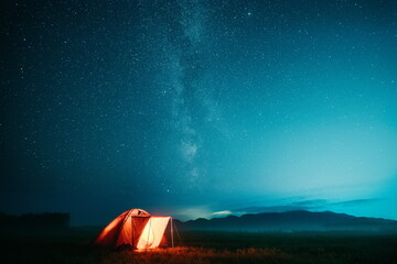 Camping on the background of the starry sky