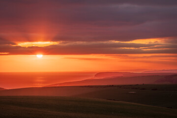 Fototapeta na wymiar April sunset out to sea from Beachy Head on the South Downs East Sussex
