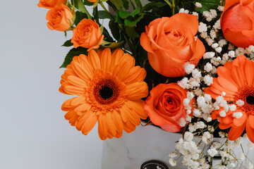 Floral chest with mini rose, colorful roses and gerbera.