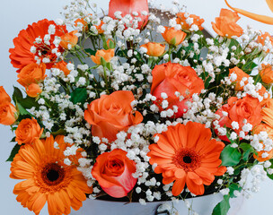 Floral chest with mini rose, colorful roses and gerbera.