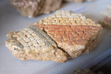 Broken remains of excavated Mosaic floor pieces from a Roman Villa in West Sussex, England