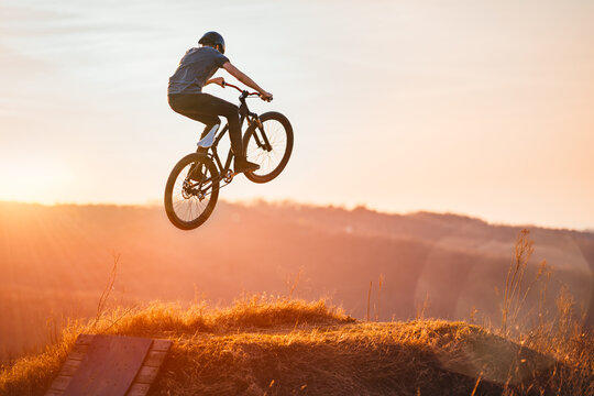 Young Man Flying Through The Air On A Mountain Bike