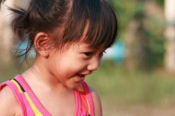 Portrait of asian baby girl, a cute face and smiling ,Walking in the front yard