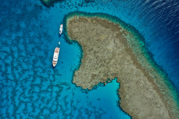 Top view: Boat and coral reef, Red sea Egypt