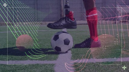 Video game digital interface against low section of male soccer player with prosthetic leg - Powered by Adobe