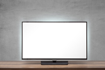 Tv set with blank screen on a wooden surface