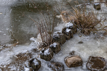 Obraz na płótnie Canvas Frozen River Shore In Winter