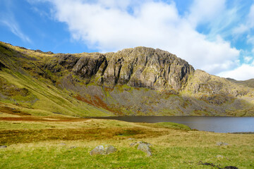 Clear waters of Stickle Tarn lake, located in the Lake District, Cumbria, UK
