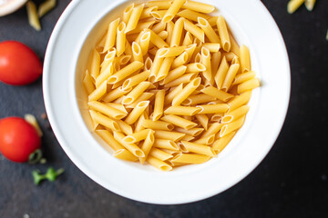 pasta penne main course italian cuisine durum wheat meal snack copy space food background rustic top view