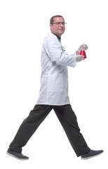 in full growth. confident scientist with a laboratory flask striding forward .