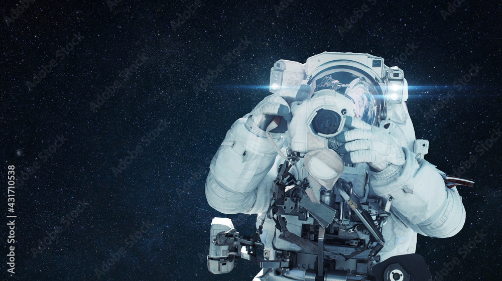 Poster man astronaut photographer makes a photo on camera in outer space with stars. space man paparazzi, c
