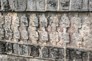 Skull reliefs at Tzompantli, the platform of skulls, Chichen-Itza, Yucatan, Mexico