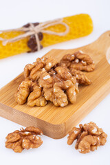 walnut, large, halves, on a wooden board, on a white background