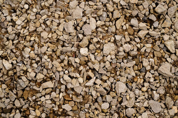 Texture of the road covered with rubble