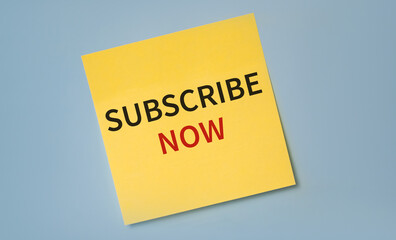 SUBSCRIBE NOW text on a stciker against blue background.