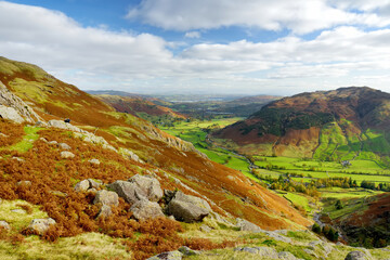 Fototapeta na wymiar Scenic view of Great Langdale valley in the Lake District, famous for its glacial ribbon lakes and rugged mountains. Popular vacation destination in Cumbria, North West England.