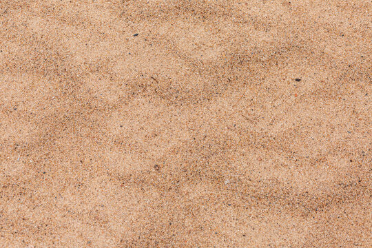 Sand surface at the beach in close up.