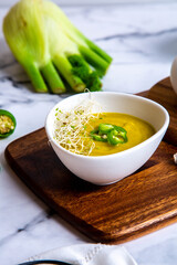 Green vegetables soup with bread