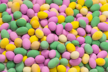 Group of colorful peanuts in glaze.