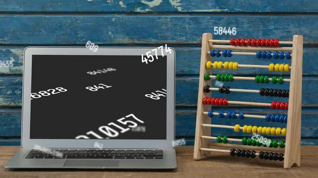 Animation of numbers changing over laptop and abacus on wooden background