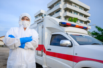 Asian male doctors in emergency ambulance wear PPE uniforms Find patients suspected of contracting the novel coronavirus in a residential area. outdoor PPE portrait,Coronavirus COVID-19 pandemic © เลิศลักษณ์ ทิพชัย