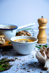 Pumpkin soup with vegetables and bread
