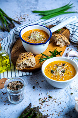 Pumpkin soup with vegetables and bread