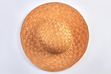Fototapeta premium Top view of vintage straw hat on white background.