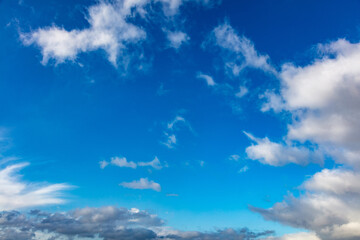 Naklejka na ściany i meble Clouds on blue sky background, copy space