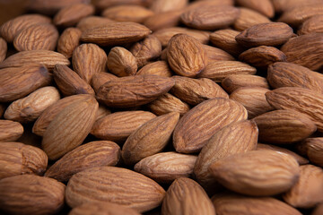 Almonds horizontal background closeup.