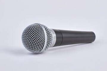 Chromed black wireless microphone isolated on white background.