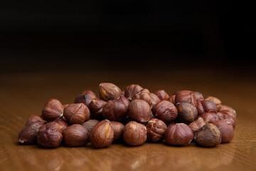 Group of hazelnuts on a wooden table