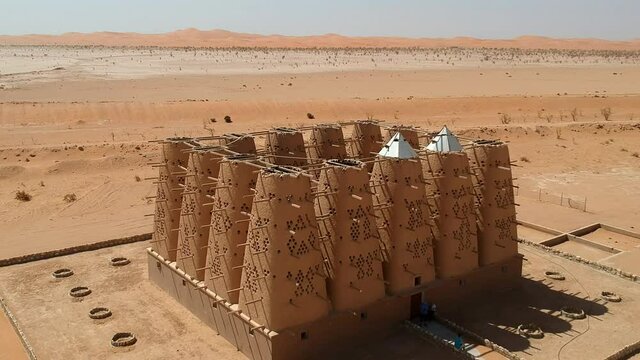 Camera drone flies over the abandoned traditional mud brick Arab dovecote in the Riyadh Province, Saudi Arabia
