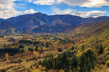 Arrowtown, New Zealand, in autumn, seen from the mountains of the Crown Range