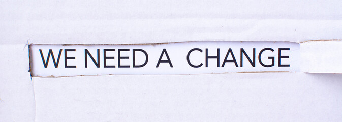The text we need a change appearing behind torn white paper. For your design, concept.