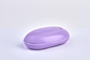 Purple soap bar isolated on white background.