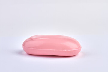 Pink soap bar isolated on white background.