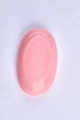 Top view of pink bar of soap isolated on white background.
